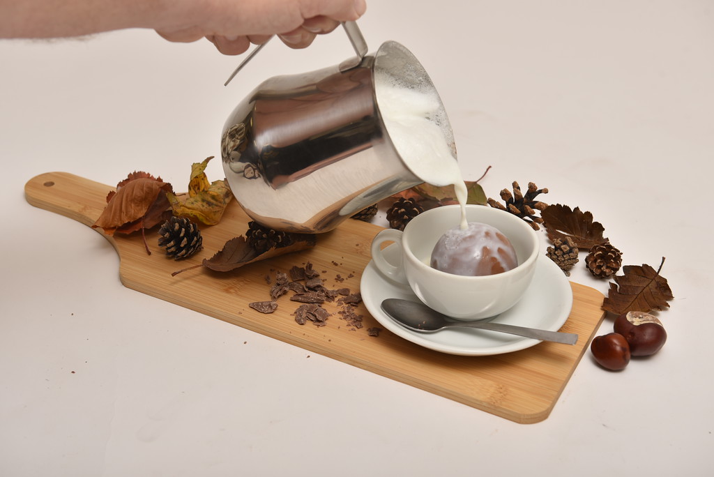 Enjoying the magic of a hot chocolate bomb