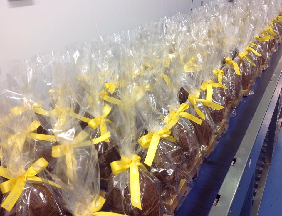 Easter Eggs on simple gold plinth packed into a clear bag and hand finished with ribbon bows.